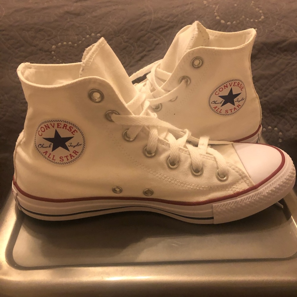 All white Converse high tops